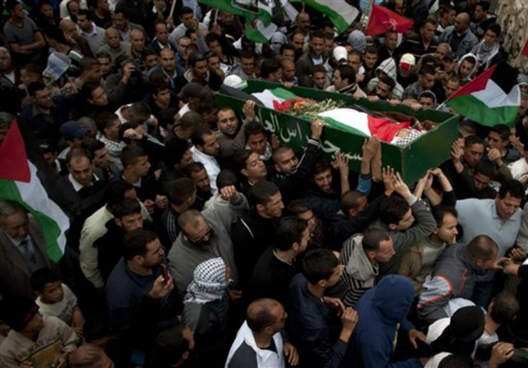 Palestinians carry the body of Milad Said Ayyash, 17, who died of wounds sustained in Friday's protests near the east Jerusalem neighborhood of Silwan during his funeral, on Saturday, May 14.